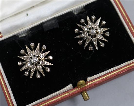 A pair of 9ct gold and diamond set starburst earrings, diameter 17mm.